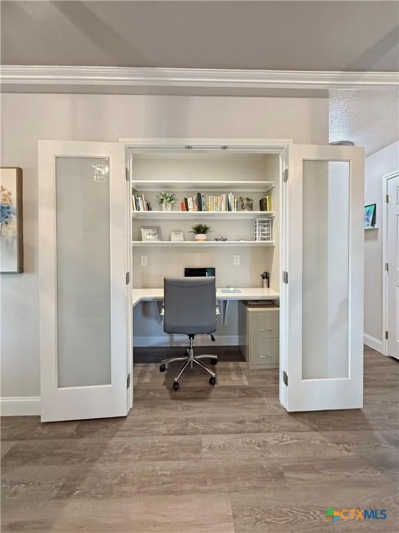 2237 Apache Dr, Harker Heights, TX 76548 - office with wood finished floors, ornamental molding, built in study area, and baseboards