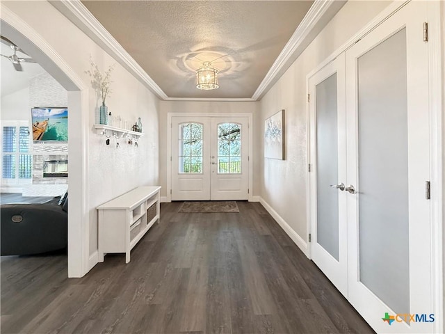 2237 Apache Dr, Harker Heights, TX 76548 - mudroom featuring a textured ceiling, french doors, dark wood-style flooring, ornamental molding, and baseboards