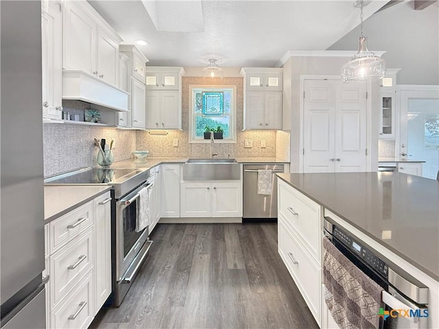 2237 Apache Dr, Harker Heights, TX 76548 - kitchen with stainless steel appliances, a sink, custom range hood, white cabinetry, and recessed lighting