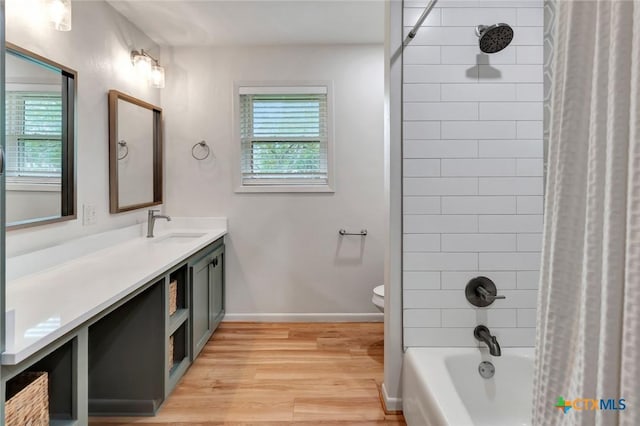 full bathroom featuring toilet, vanity, shower / bath combo, and hardwood / wood-style flooring