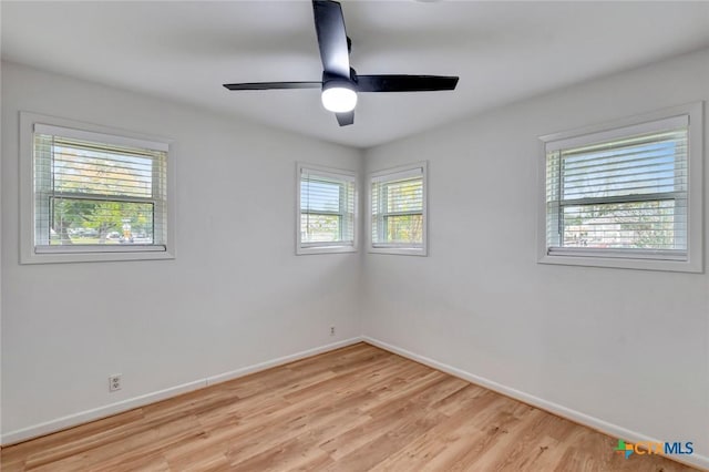 unfurnished room with ceiling fan, a healthy amount of sunlight, and light hardwood / wood-style floors