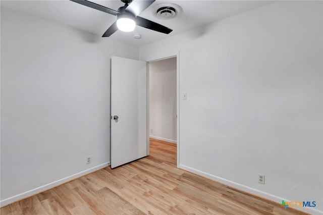 unfurnished room featuring ceiling fan and light wood-type flooring