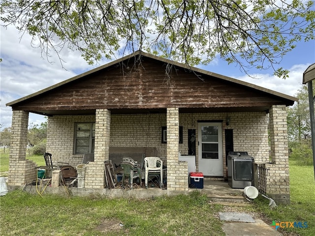rear view of house with brick siding