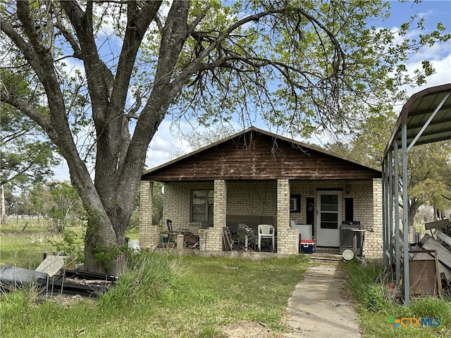 view of front of home featuring brick siding