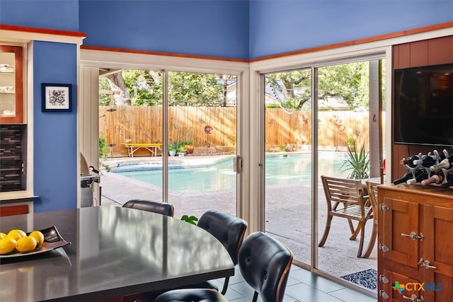 doorway to outside featuring light tile patterned floors