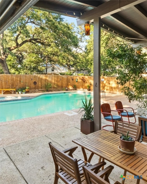 view of pool featuring a patio area