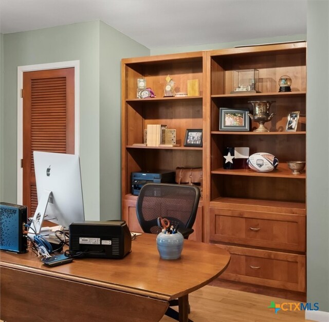 office space with light hardwood / wood-style floors