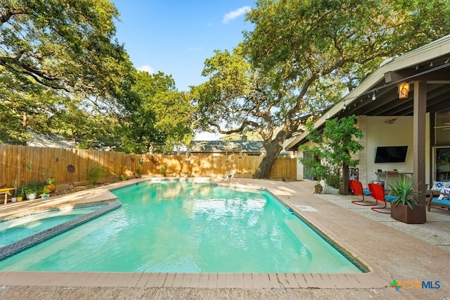 view of swimming pool with a patio