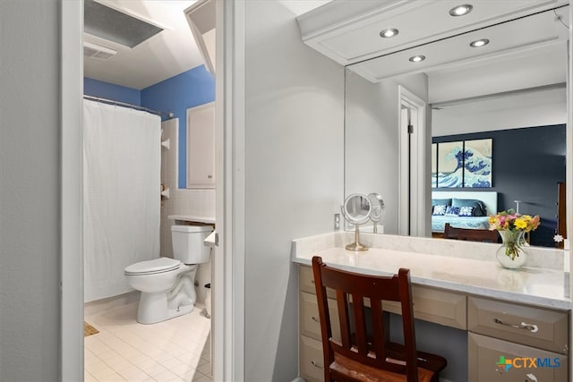 bathroom featuring tile patterned flooring, vanity, and toilet