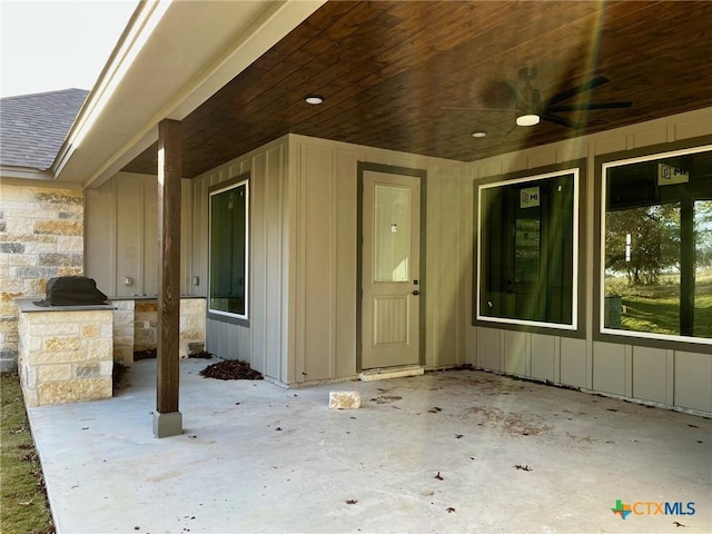 view of patio with ceiling fan and exterior kitchen