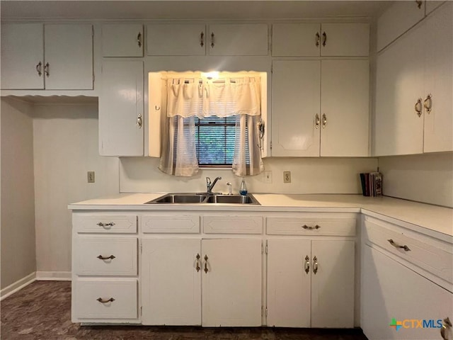 2809 Forest Trl, Temple, TX 76502 - kitchen with a sink, white cabinets, and light countertops