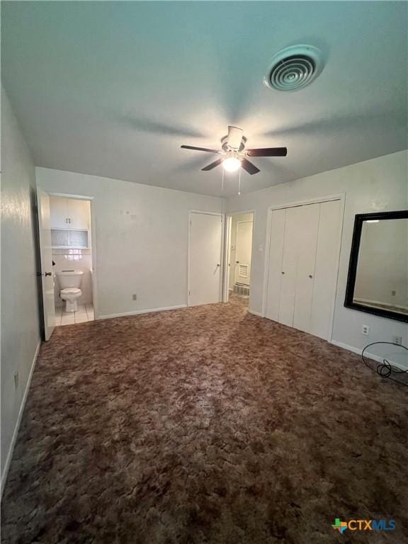 2809 Forest Trl, Temple, TX 76502 - unfurnished bedroom with carpet, baseboards, connected bathroom, and a ceiling fan