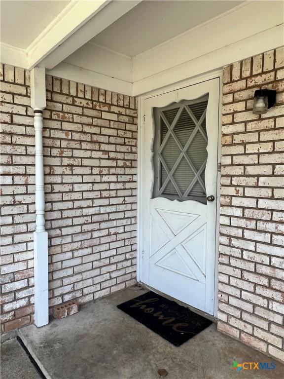2809 Forest Trl, Temple, TX 76502 - doorway to property with brick siding