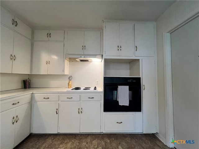 2809 Forest Trl, Temple, TX 76502 - kitchen featuring black oven, under cabinet range hood, white electric stovetop, light countertops, and white cabinetry