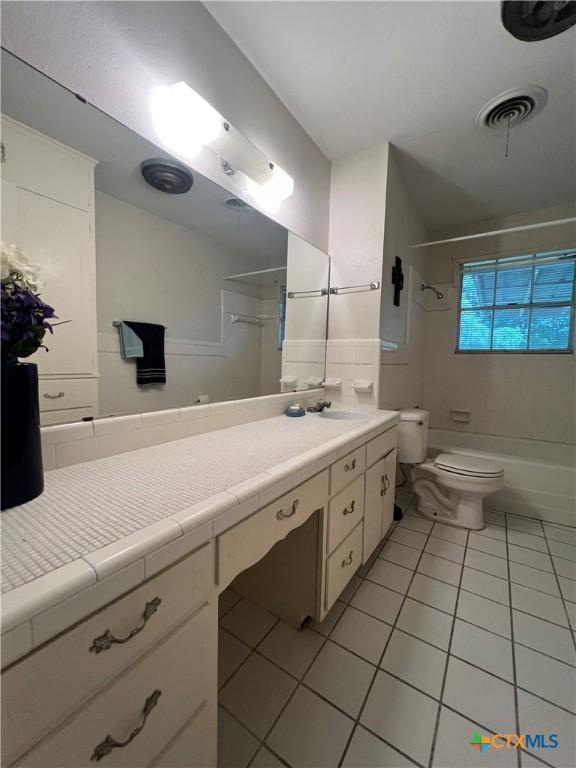 2809 Forest Trl, Temple, TX 76502 - bathroom with tile patterned flooring, vanity, shower / bath combination, and toilet