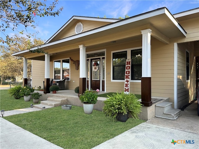 view of front facade with a porch and a front yard