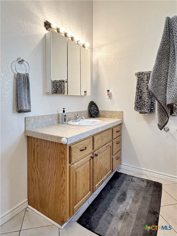 bathroom featuring vanity and tile patterned floors