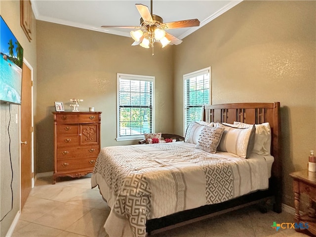 bedroom with ornamental molding, ceiling fan, and light tile patterned floors