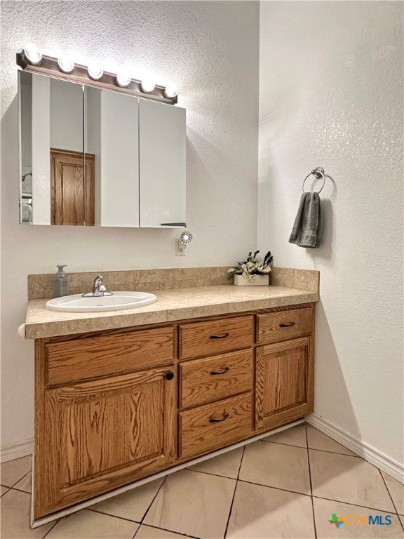 bathroom with vanity and tile patterned floors