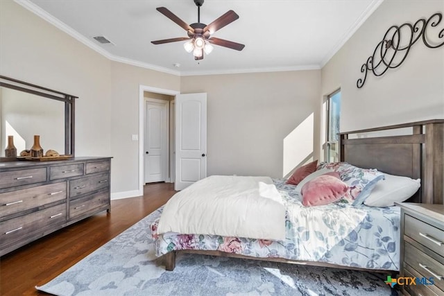 bedroom with crown molding, dark wood-type flooring, and ceiling fan