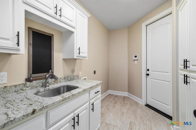 4012 Turning Leaf Dr, Nolanville, TX 76559 - laundry area with cabinet space, light marble finish flooring, baseboards, and hookup for a washing machine