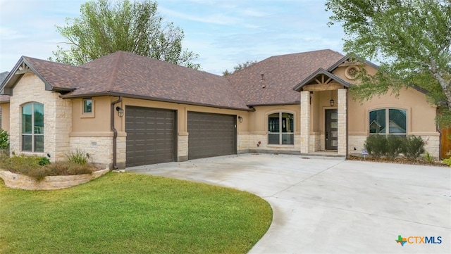 4012 Turning Leaf Dr, Nolanville, TX 76559 - french country style house with stone siding, stucco siding, a garage, concrete driveway, and a shingled roof