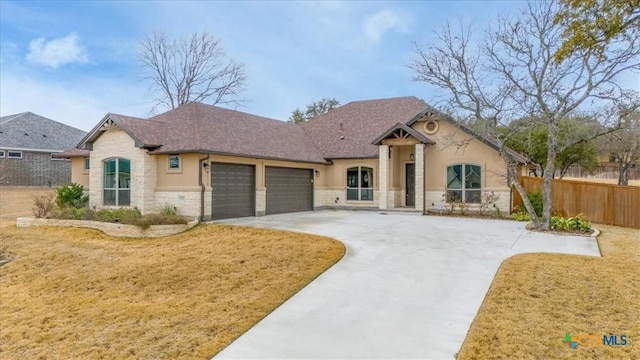 view of front of property with a front lawn and a garage