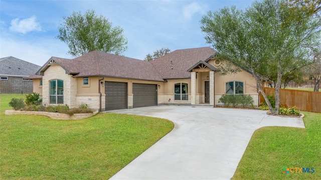 4012 Turning Leaf Dr, Nolanville, TX 76559 - french provincial home featuring stone siding, stucco siding, a garage, and concrete driveway