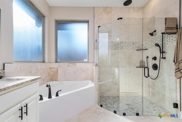 bathroom featuring vanity and plus walk in shower