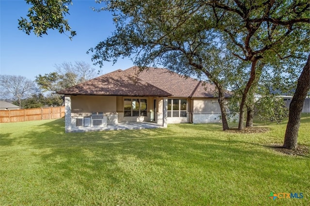 4012 Turning Leaf Dr, Nolanville, TX 76559 - back of property with stucco siding, a patio, and a shingled roof