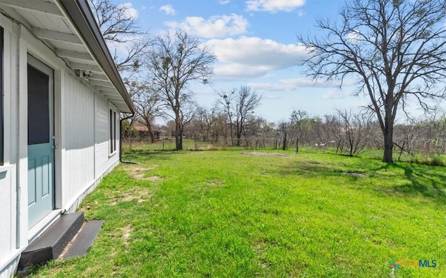 view of yard featuring fence