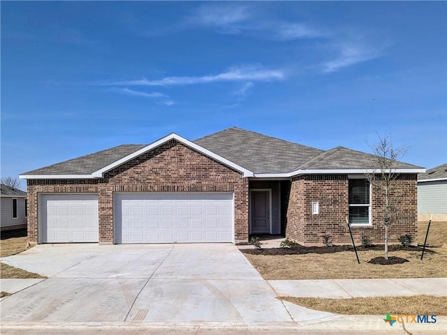 ranch-style house featuring a garage