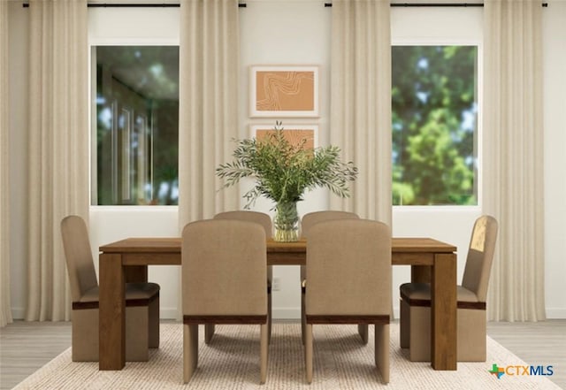 dining area with wood-type flooring