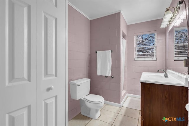 full bathroom with toilet, tile patterned flooring, crown molding, a shower stall, and vanity