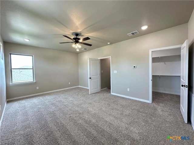 6132 Messina Dr, Temple, TX 76502 - unfurnished bedroom featuring carpet floors, a walk in closet, a ceiling fan, and recessed lighting