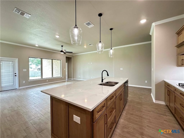 6132 Messina Dr, Temple, TX 76502 - kitchen with crown molding, light wood-type flooring, decorative light fixtures, an island with sink, and dishwasher