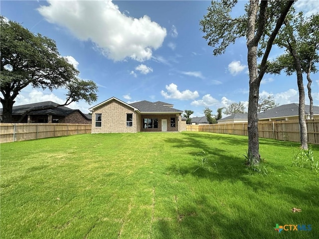 6132 Messina Dr, Temple, TX 76502 - back of property with a fenced backyard and stone siding