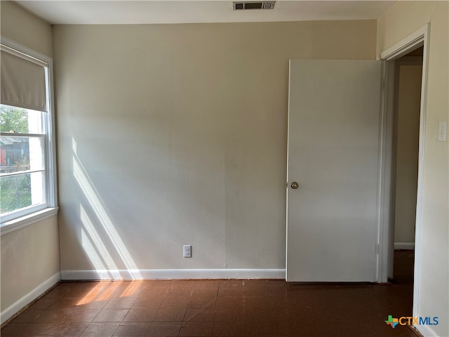 empty room featuring plenty of natural light