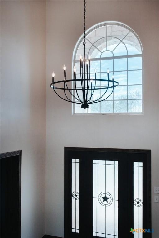 foyer with a notable chandelier