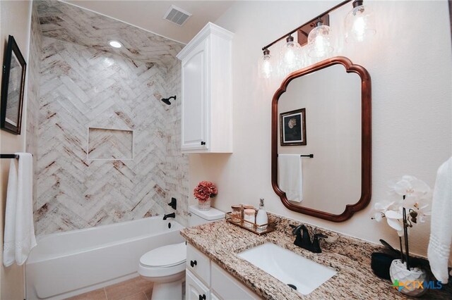 bathroom with visible vents, shower / bathing tub combination, toilet, vanity, and tile patterned floors