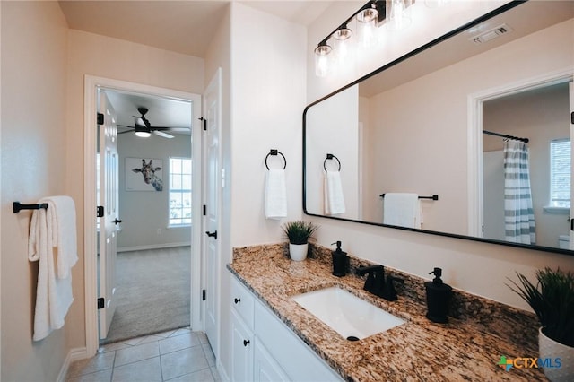 full bathroom with tile patterned flooring, visible vents, vanity, and baseboards