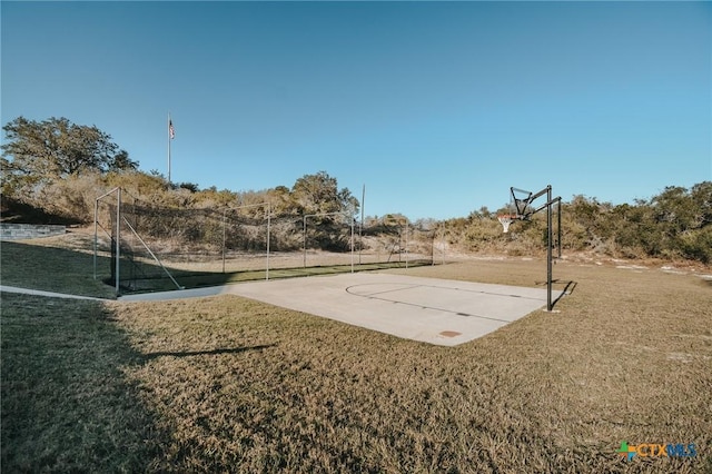 view of sport court featuring a yard and community basketball court