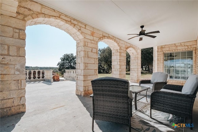 view of patio featuring a ceiling fan