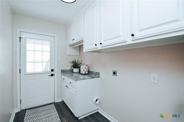 laundry area with dark wood-style floors, cabinet space, electric dryer hookup, and baseboards