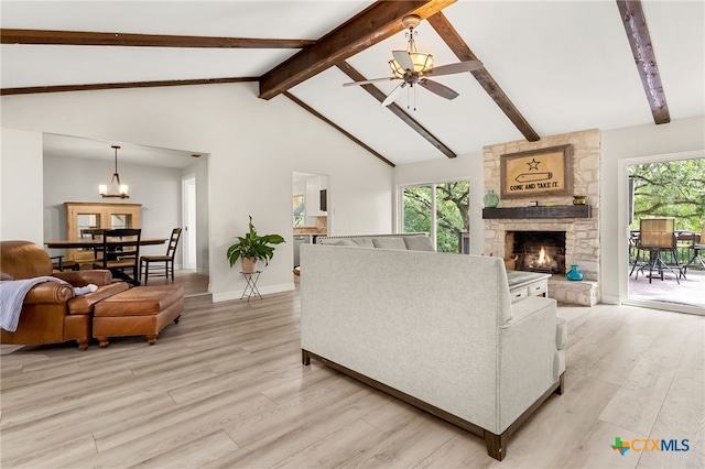 15118 Circle Oak St, San Antonio, TX 78232 - living room with ceiling fan, light wood-style floors, beamed ceiling, plenty of natural light, and a fireplace