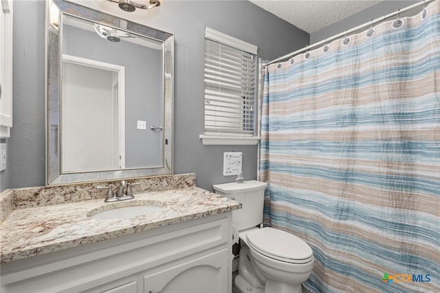 15118 Circle Oak St, San Antonio, TX 78232 - bathroom featuring a textured ceiling, toilet, vanity, and curtained shower