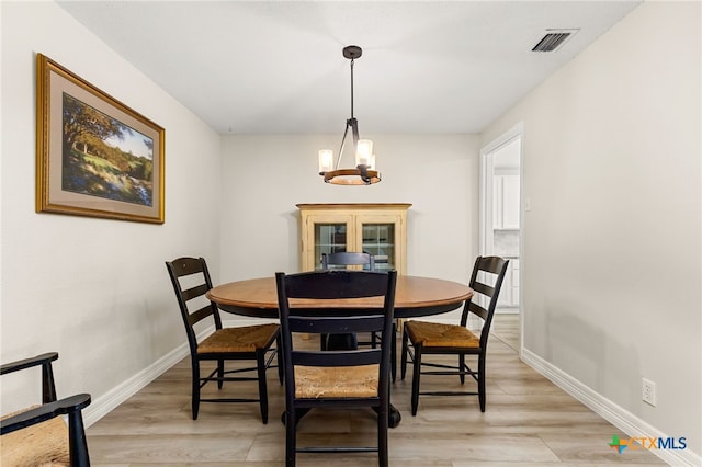 15118 Circle Oak St, San Antonio, TX 78232 - dining space with light wood-type flooring, baseboards, and a chandelier