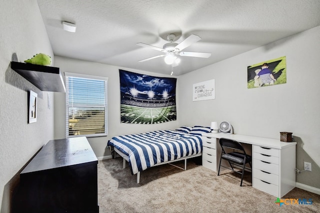 31696 Bard Ln, Bulverde, TX 78163 - bedroom featuring carpet floors, a textured ceiling, ceiling fan, and baseboards