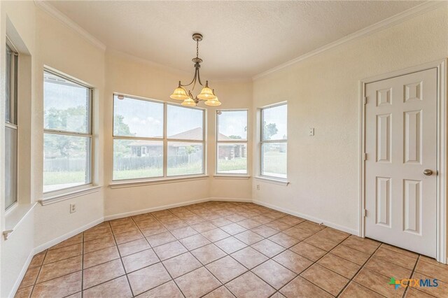 3302 Colorado Dr, Copperas Cove, TX 76522 - unfurnished dining area featuring crown molding, a chandelier, light tile patterned floors, a textured ceiling, and baseboards