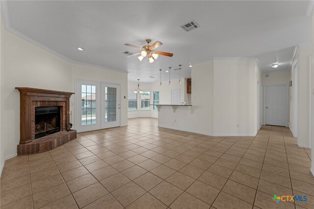 3302 Colorado Dr, Copperas Cove, TX 76522 - unfurnished living room featuring a ceiling fan, light tile patterned floors, a brick fireplace, crown molding, and baseboards